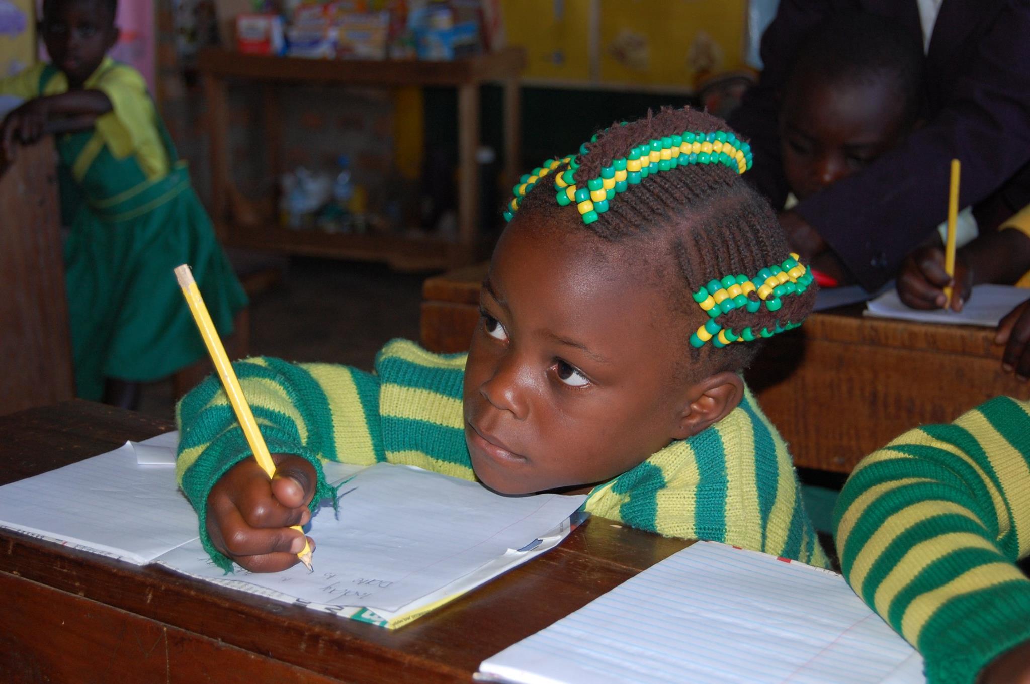 A child studying at Child Africa Jr. School